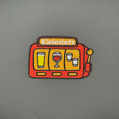 Embleem slotmachine met text "Kieleslots"