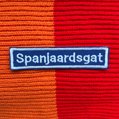 Blauw straatnaambord van Spanjaardsgat.